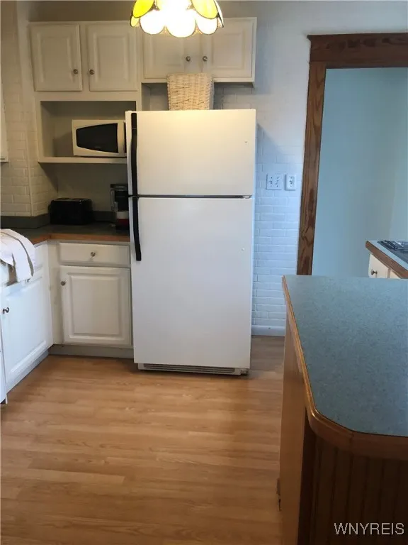 TO BACK HALL/BASEMENT -