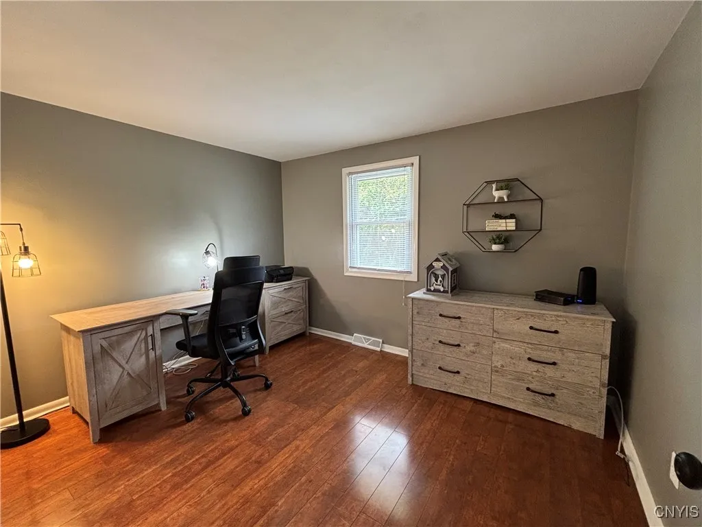 First bedroom being utilized as an office area.
