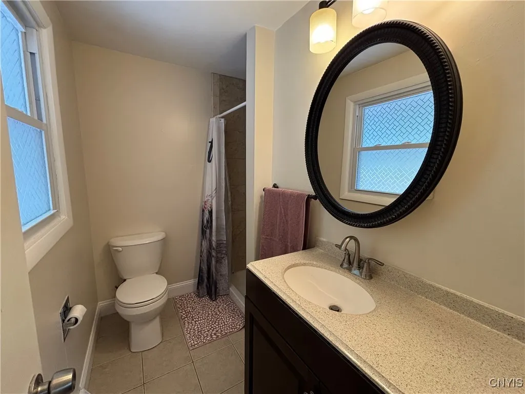 Full bathroom and 3rd/main bedroom