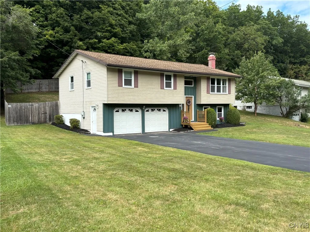 Situated on a nice lot with a spacious black top driveway.