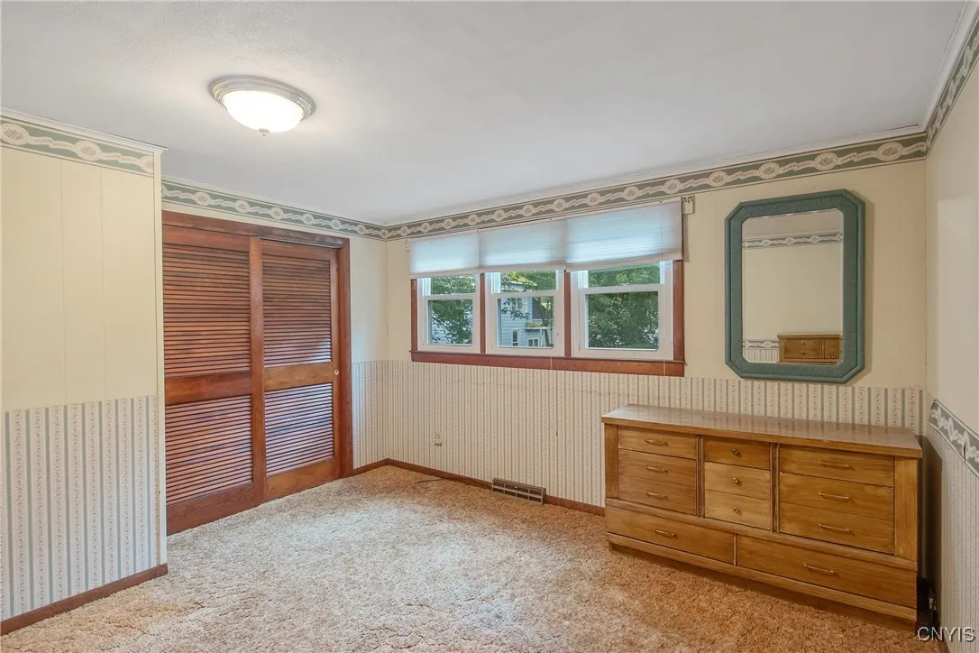 Large primary bedroom includes half bath