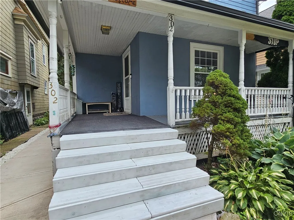 New sidewalk and walkway leads to rear patio