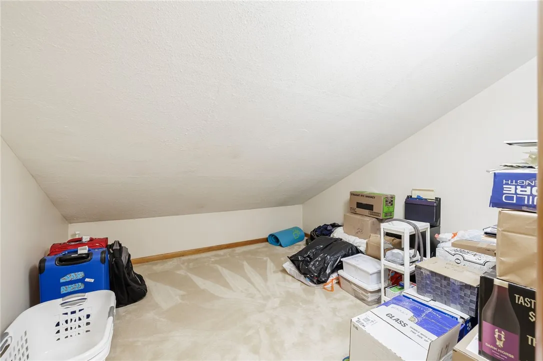 Full height portion of room large enough for a desk and shelves