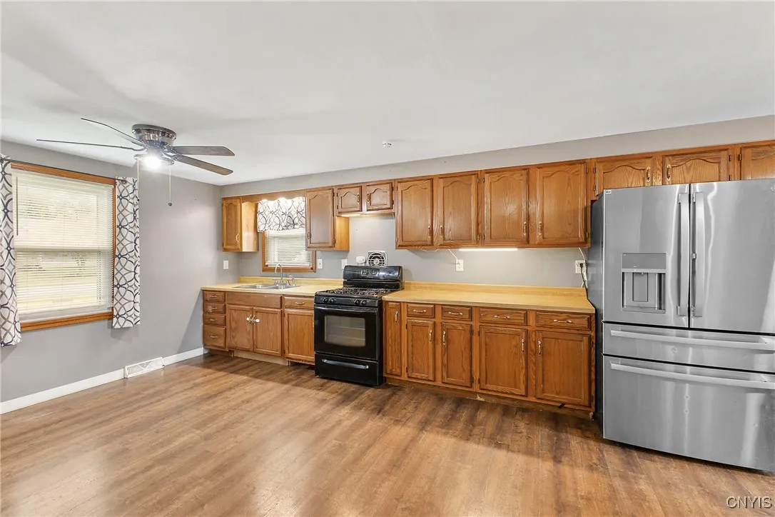   Kitchen goes from front to back on the house, and has 2 windows.