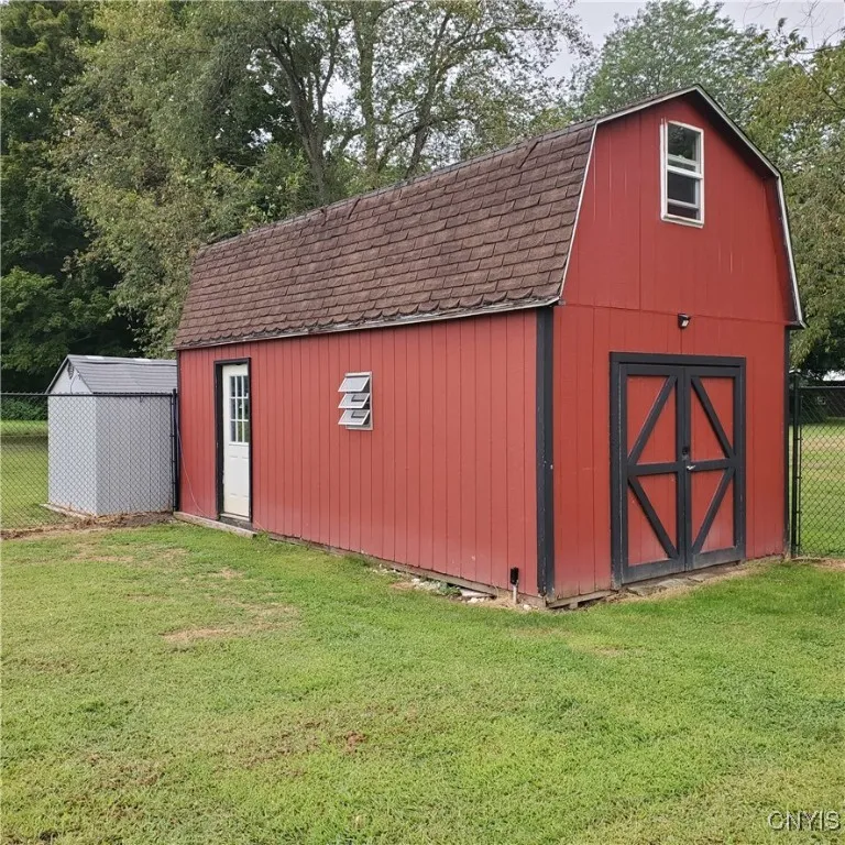   Red shed has a staircase to a 2nd floor.