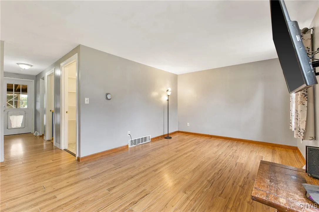 Second view of the living room & hallway to bedroom & bath.  Back door
  goes to the  30 X 10 covered deck.