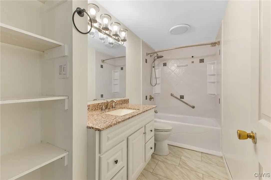 Full bath has been recently redone !!  Granite countertop on
  extra long vanity.  Linen area on the left.