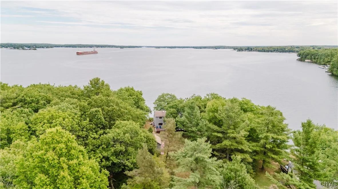 View from the back of the pie shaped 1 acre lot looking downriver toward the bridge
