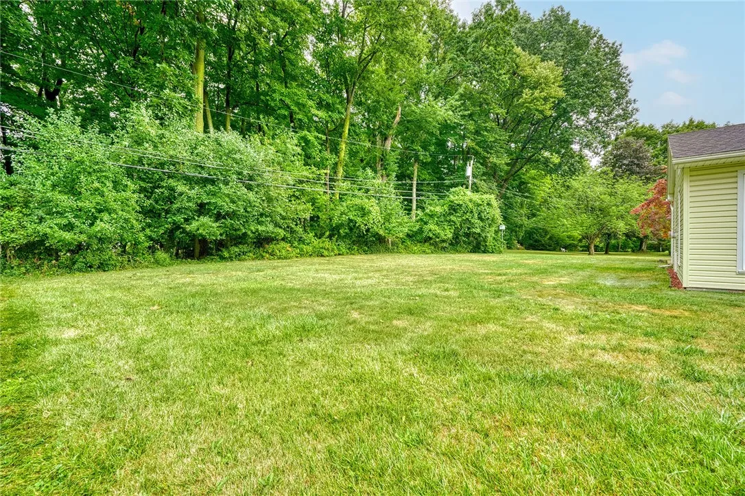 Great private treed backdrop on a quiet residential street!