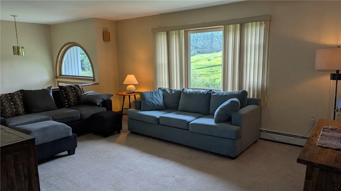 Spacious living room with large windows display wonderful views
