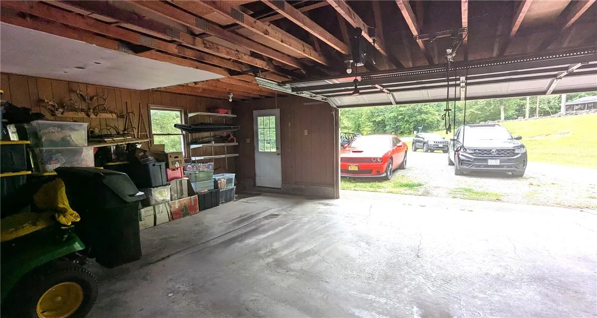 2 car garage has plenty of room for mowers, additional storage