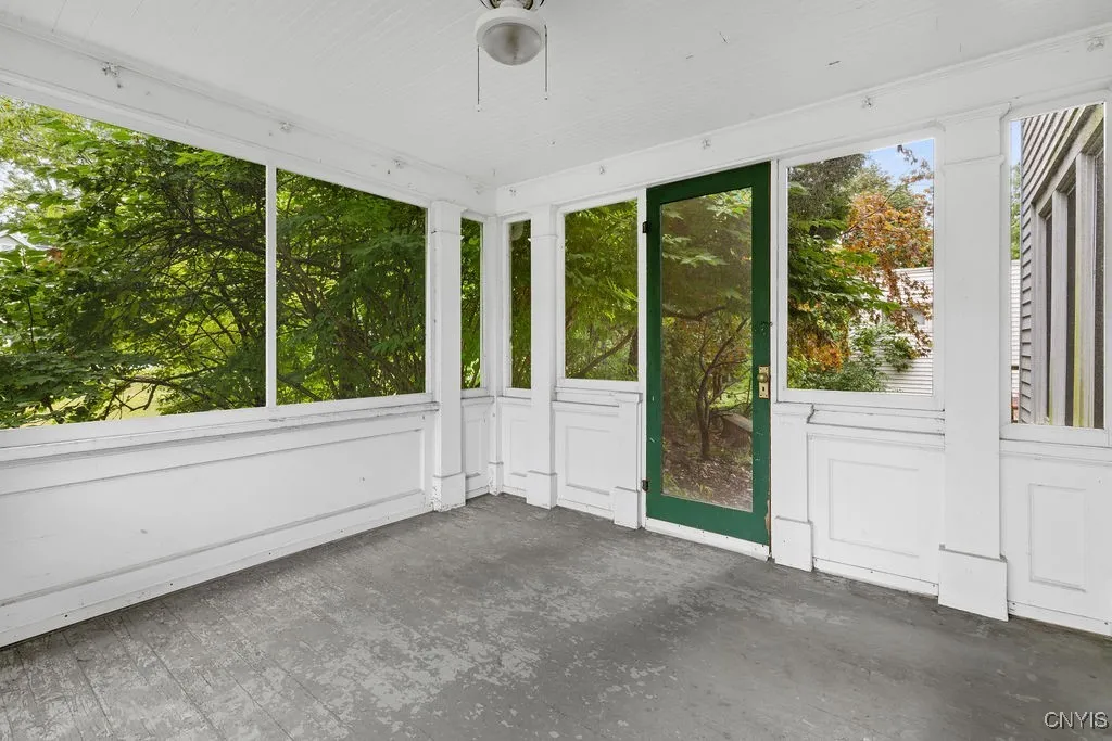 Screened in porch.  Leads to private patio and deck.