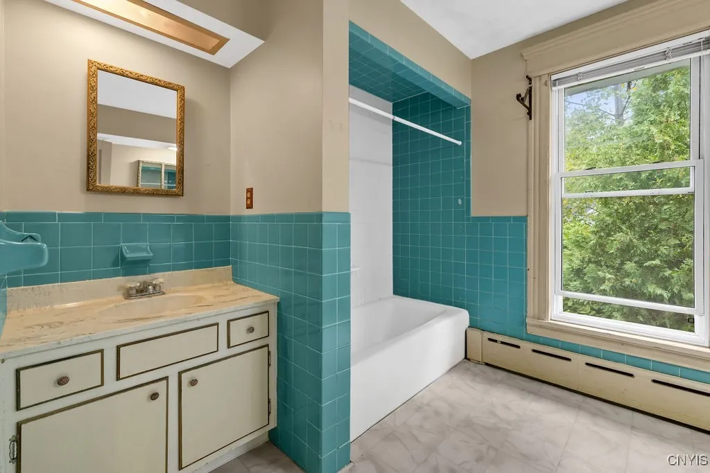Large main floor bathroom has 2 separate vanity sinks.