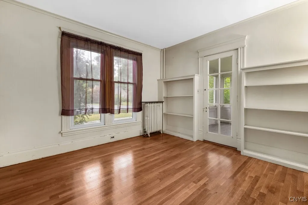 Library just off the living room.  Door in picture leads to the screened-in porch.