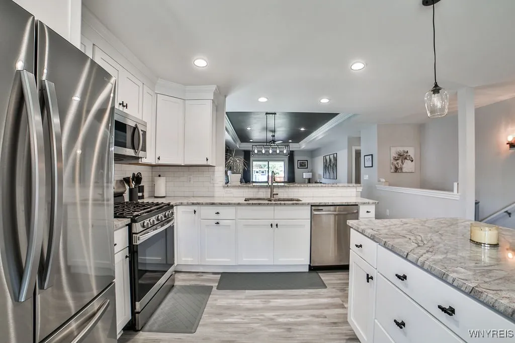 Stainless steel appliances refrigerator and stove included.