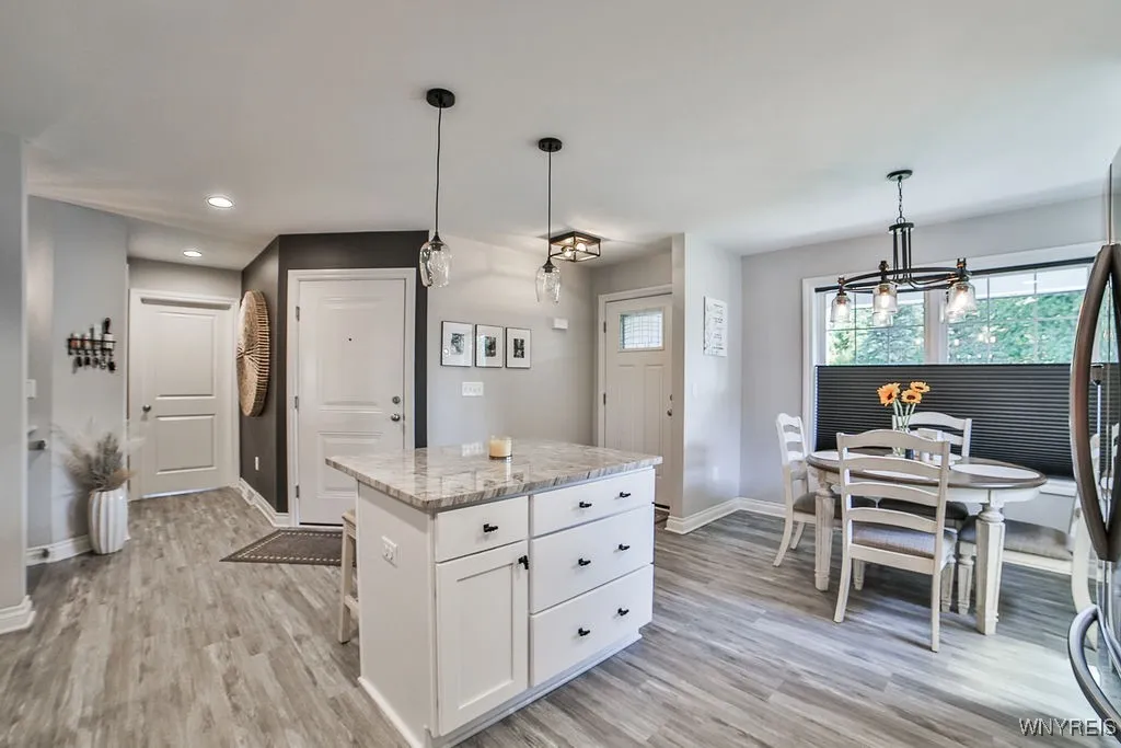 Kitchen with center island. Beautiful Luxury vinyl flooring.