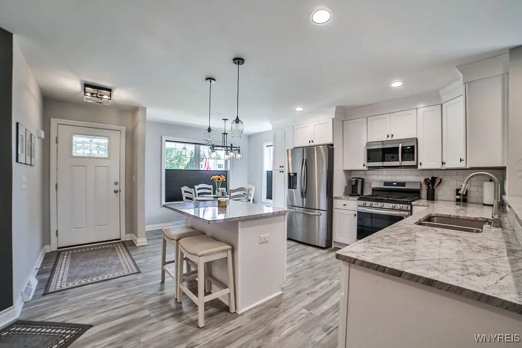Front entrance into kitchen and breakfast nook.