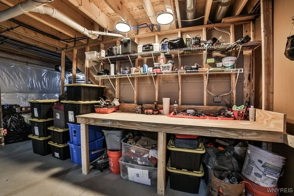 Basement has tons of room for additional storage, workshop, or more finished areas