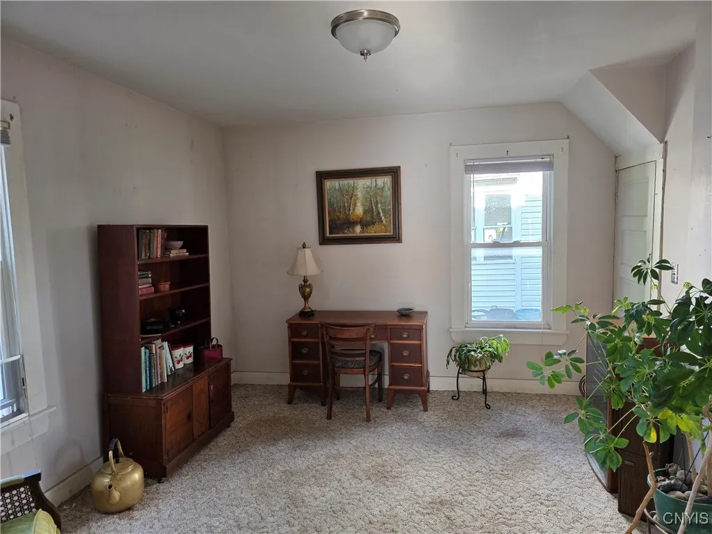family roof adjoining eat-in kitchen with door to basement in far right corner