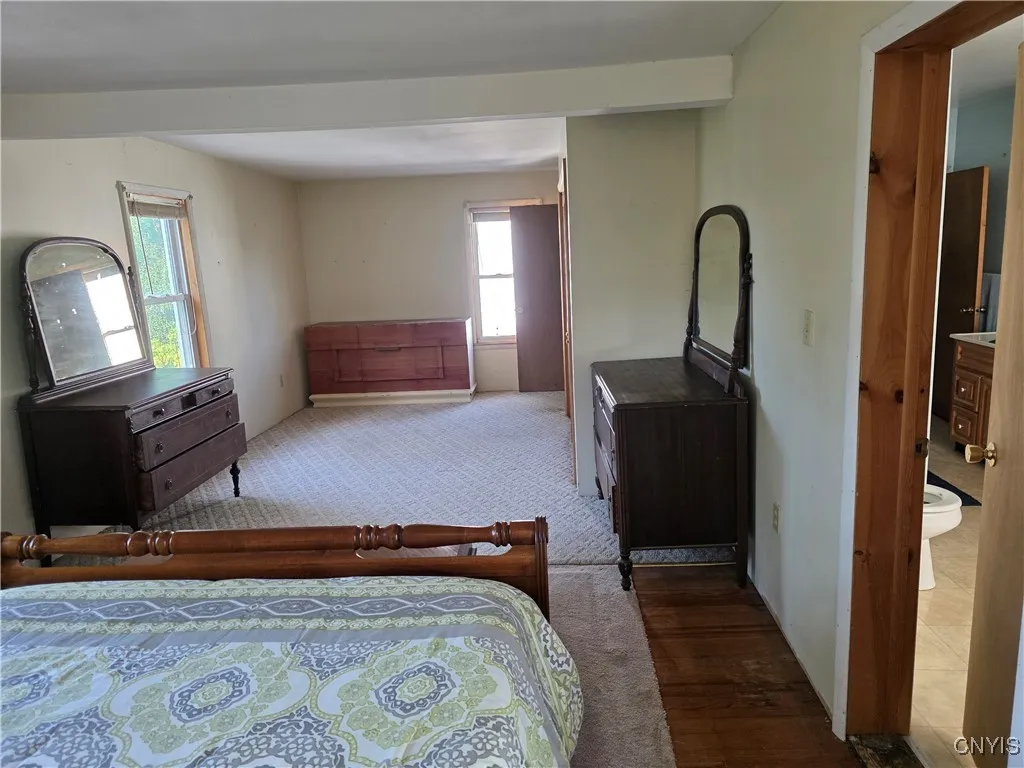 Primary bedroom with access door to 2nd floor large bathroom