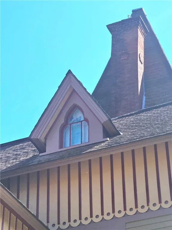 Gothic windows, brick detail on fireplace,