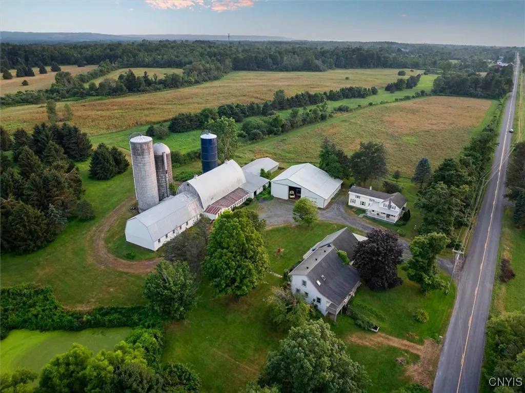 2 homes, a dairy barn, pole barn, and 131 acres included.