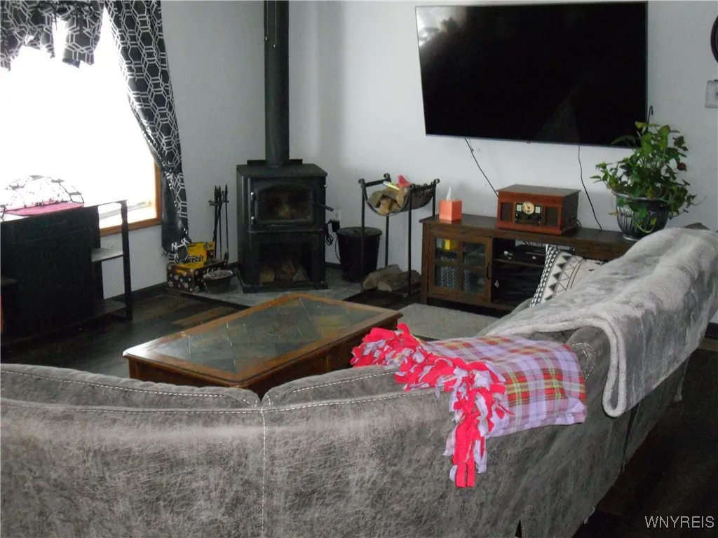 living room with wood stove for warm winters