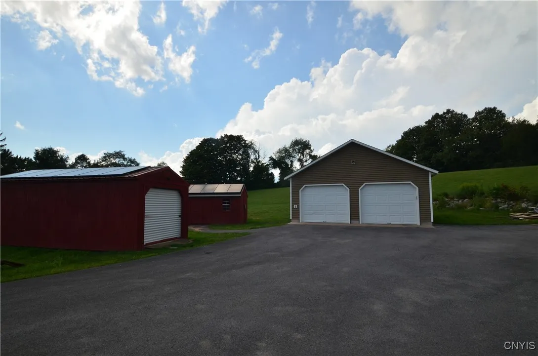 Garage and two large sheds/with solar panels