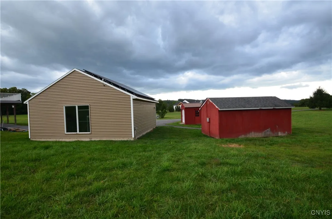 garage and two large sheds/solar panels