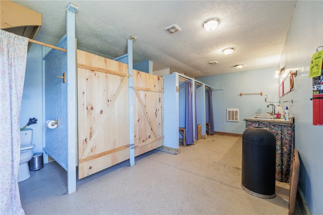 The bath house with shower stalls.  This is identical on each side