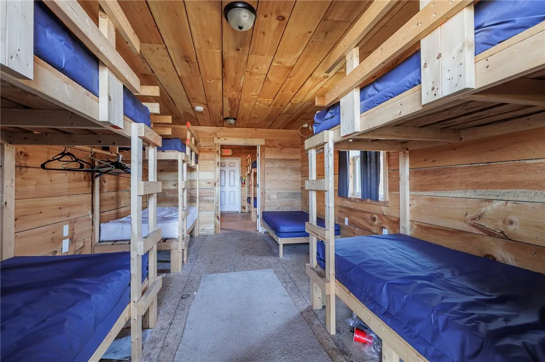 View of the inside of one of the bunk houses.  The bunk house is split in two with each side looking identical.
