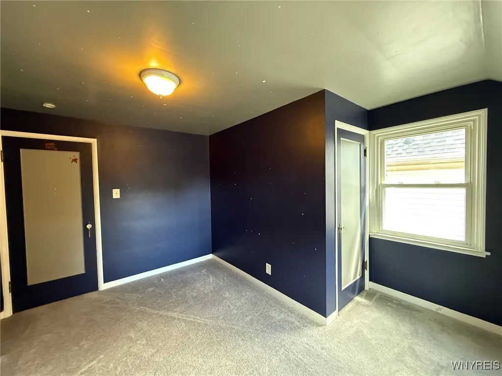 Second floor bedroom two with walk up attic access