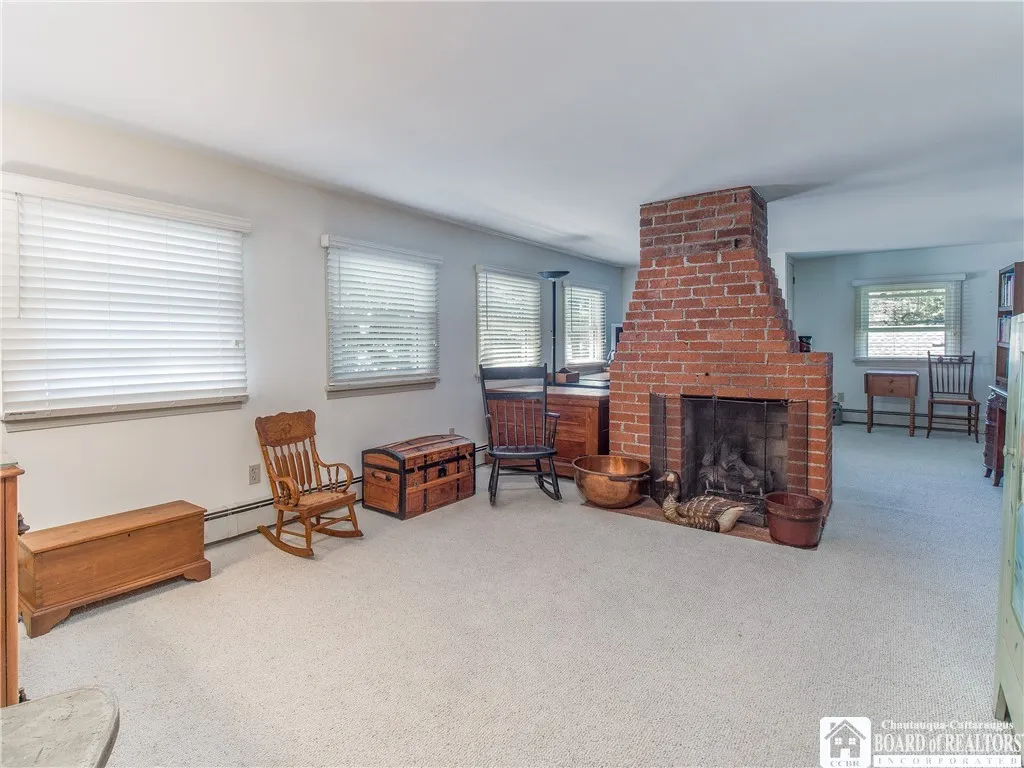Spacious second floor family room overlooking the lake with gas fireplace