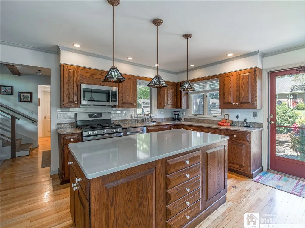 Updated kitchen off the front entry...lovely hardwood floors