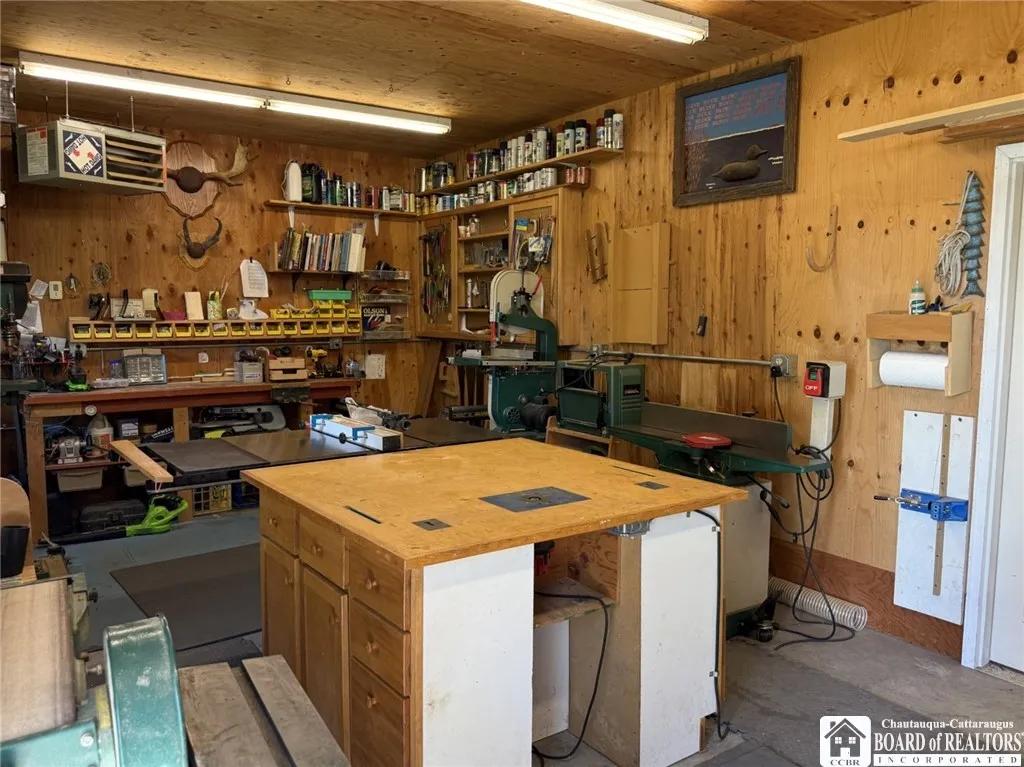 Workshop section of the garage with space heater and electric service