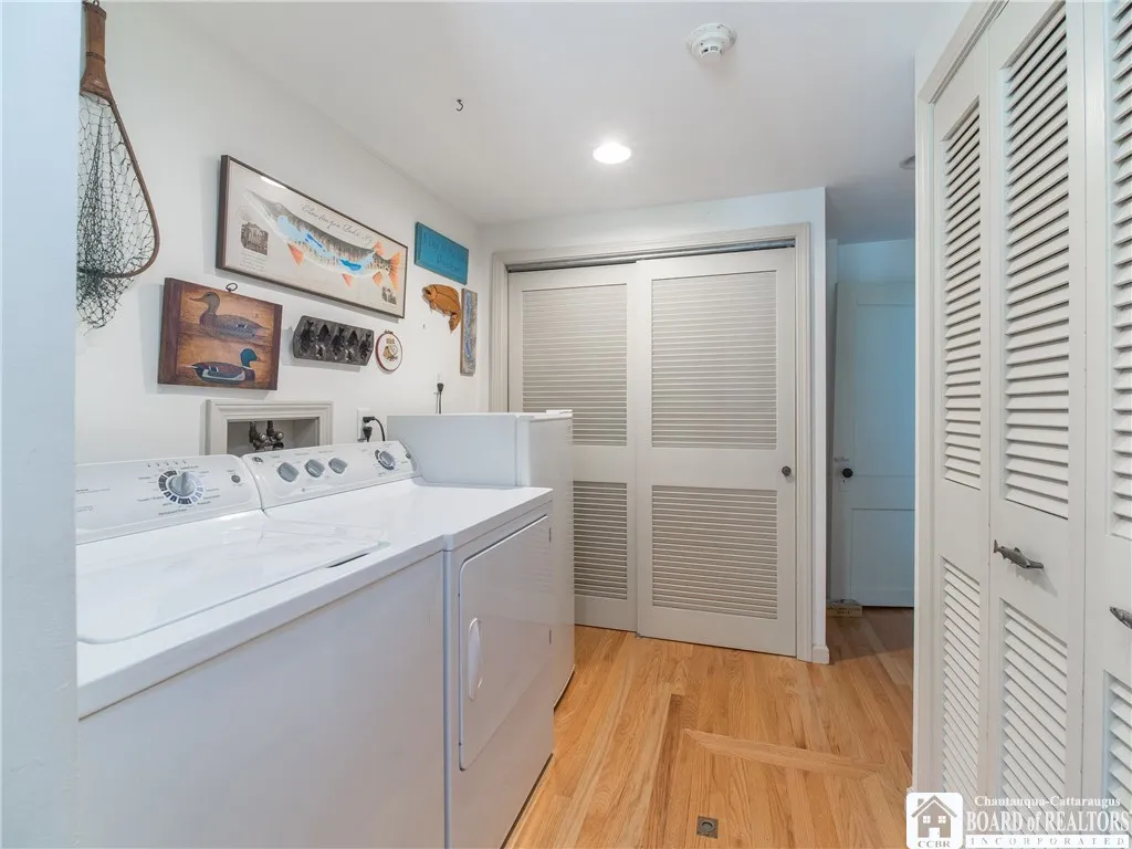 Laundry room with two sets of closets...another access to the crawl space with the furnace and hot water tank