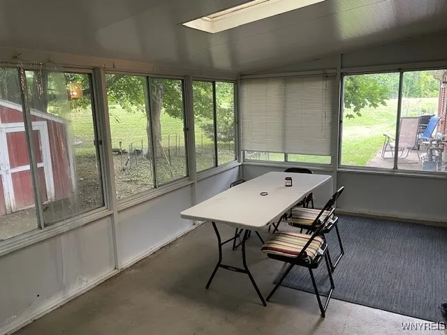 The left side facing the house has a summer room off the kitchen.  Great space for summer dinners.