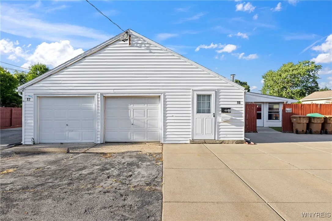1 car attached Garage ,  & a 2nd 2.5 car garage in back of property