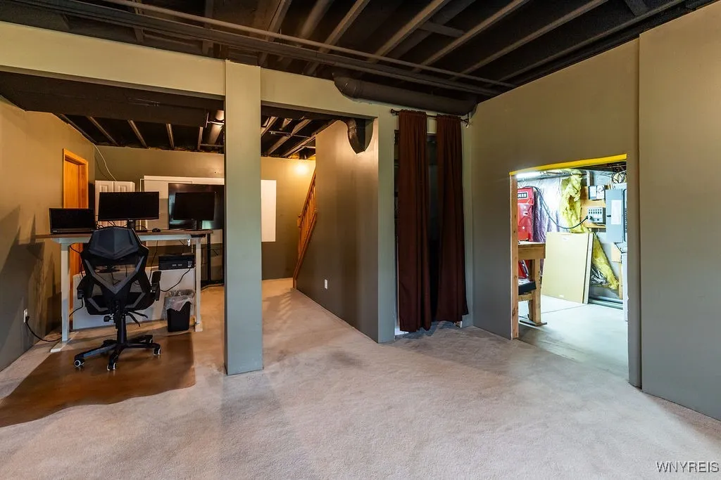 Family room/theater area(Noticed the white wall, great to add a projection TV) Also, to the right is to the tool/storage area.