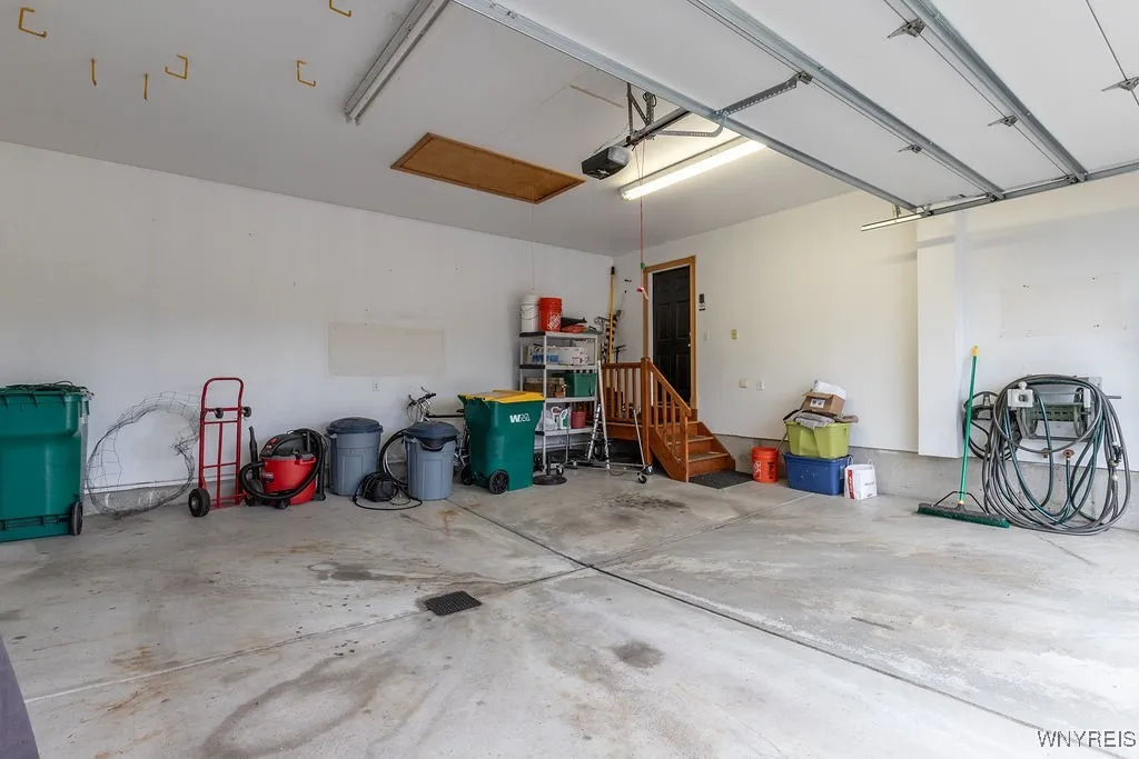 Nice size Attached 2 1/2 car.  Garage with storage above and drain below! Indoor water spicket!!Note: insulated garage door too!