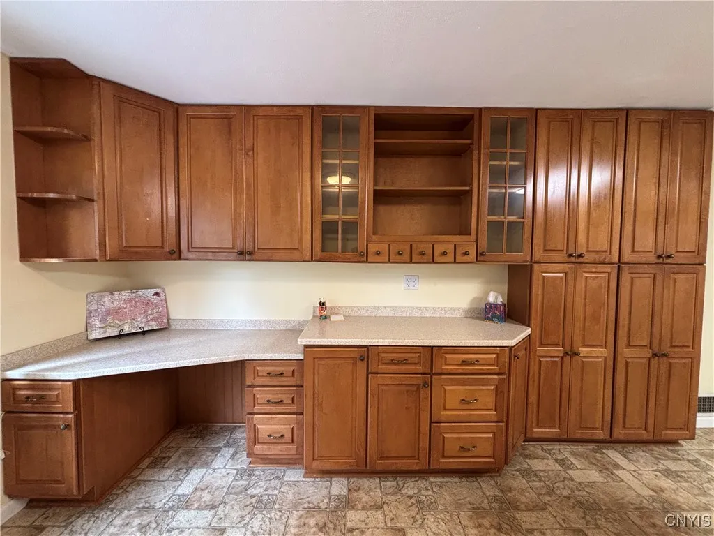 Wall of cabinets and desk area