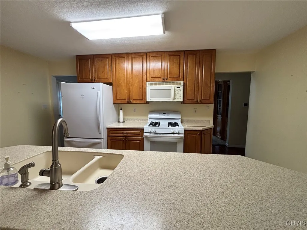 Gas stove, microwave and refrigerator