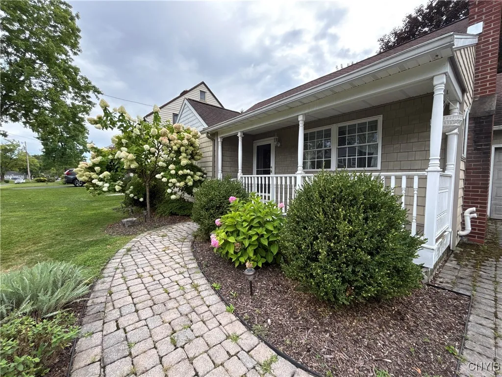 Paved sidewalk to the spacious front porch