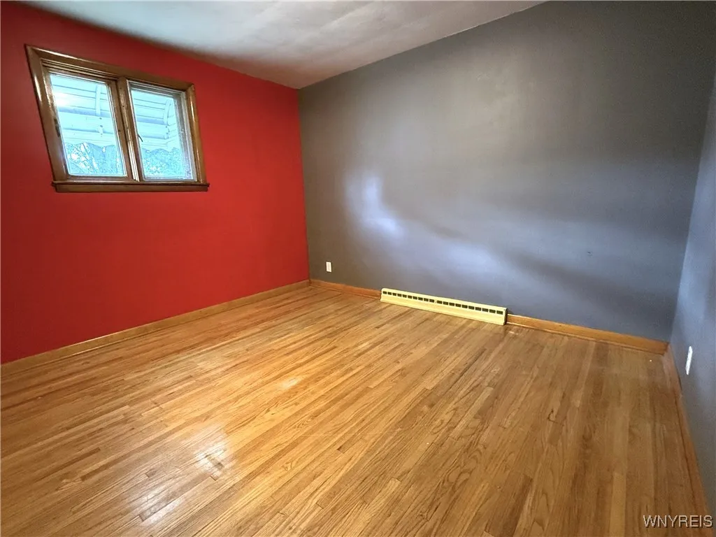 Primary Bedroom with Lovely Hardwood Floors