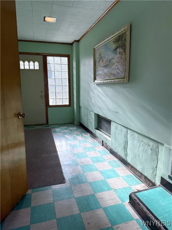 Breezeway between house and garage, door to yard.