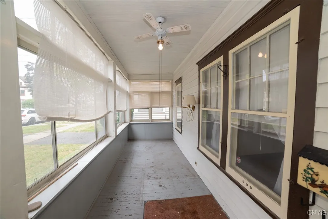This covered porch is great for storage and recreational sitting.