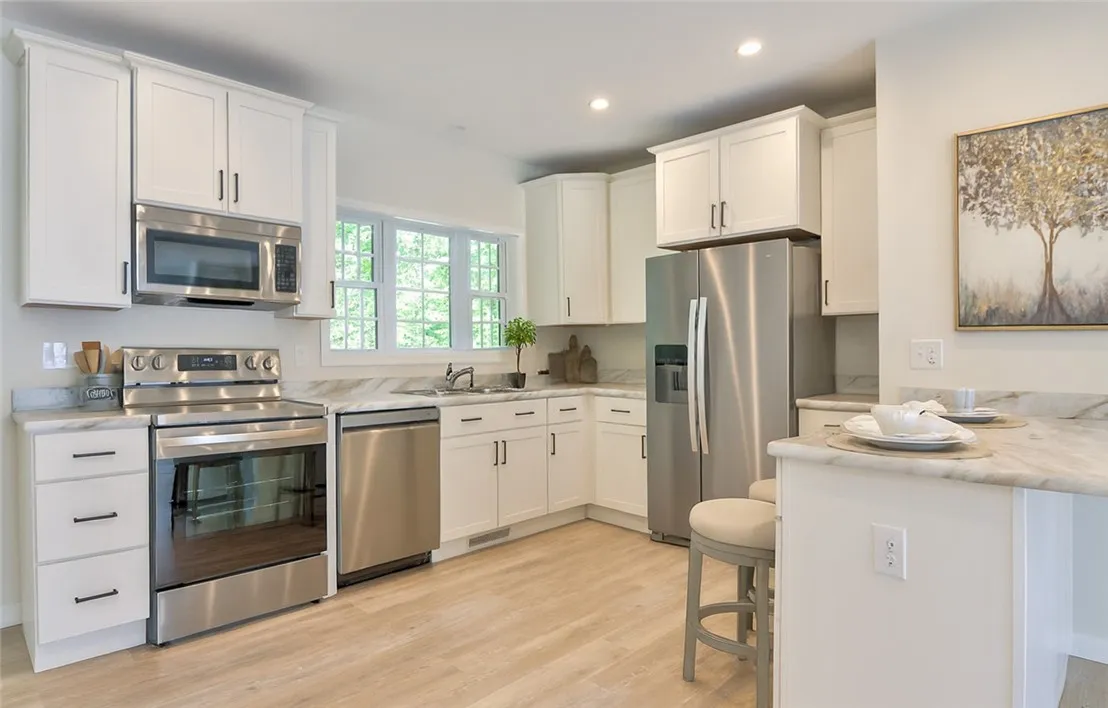 Kitchen area with peninsula- virtually staged