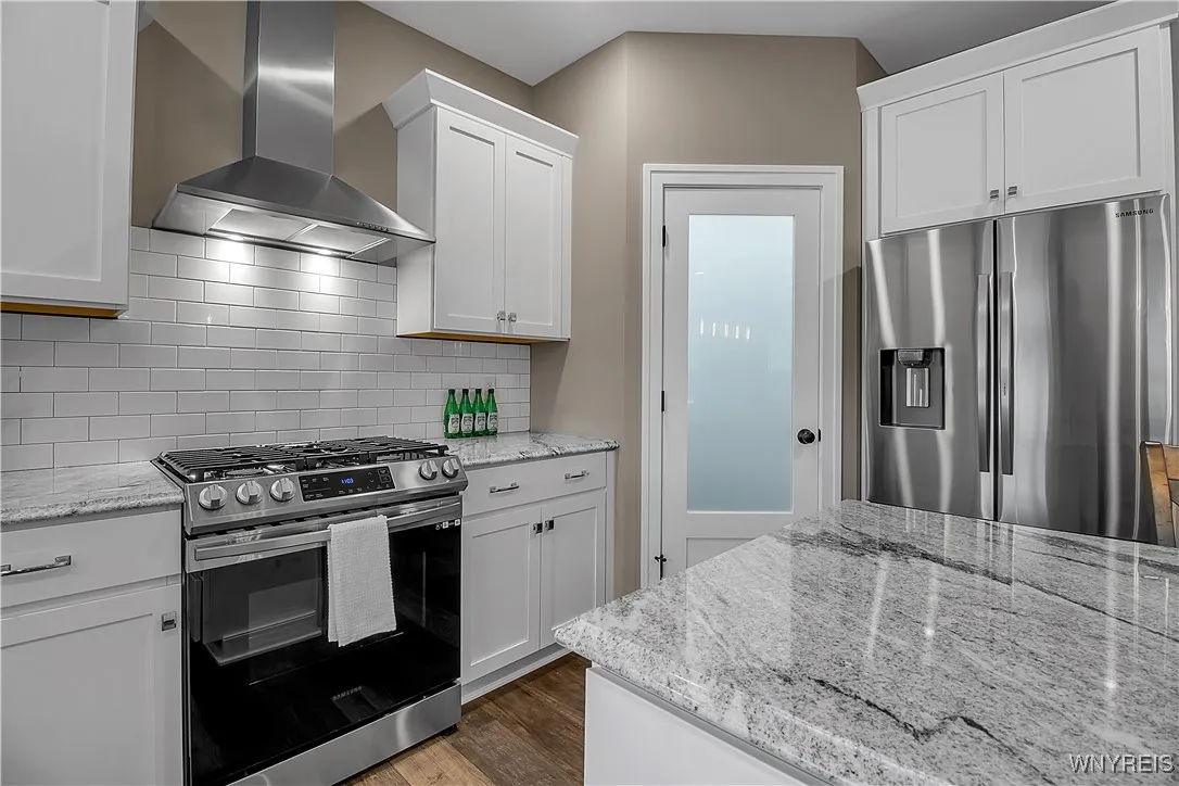 Stainless steel appliances and a beautiful pantry door!