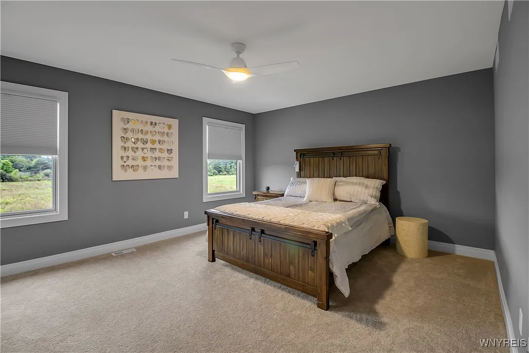 Primary bedroom is a perfect size and has a nice view