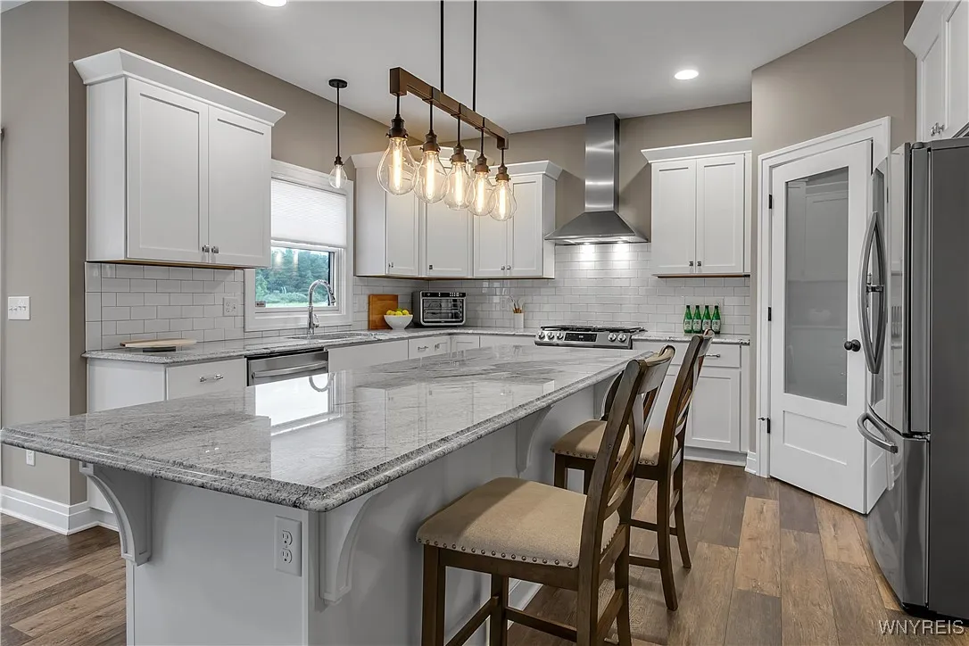 Kitchen is dominated by this granite-topped island for eating or prep work